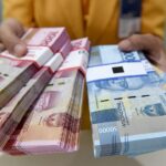Ilustrasi Uang pecahan seratus ribu dan lima puluh ribu rupiah Antara Foto