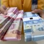 Ilustrasi Uang pecahan seratus ribu dan lima puluh ribu rupiah Antara Foto